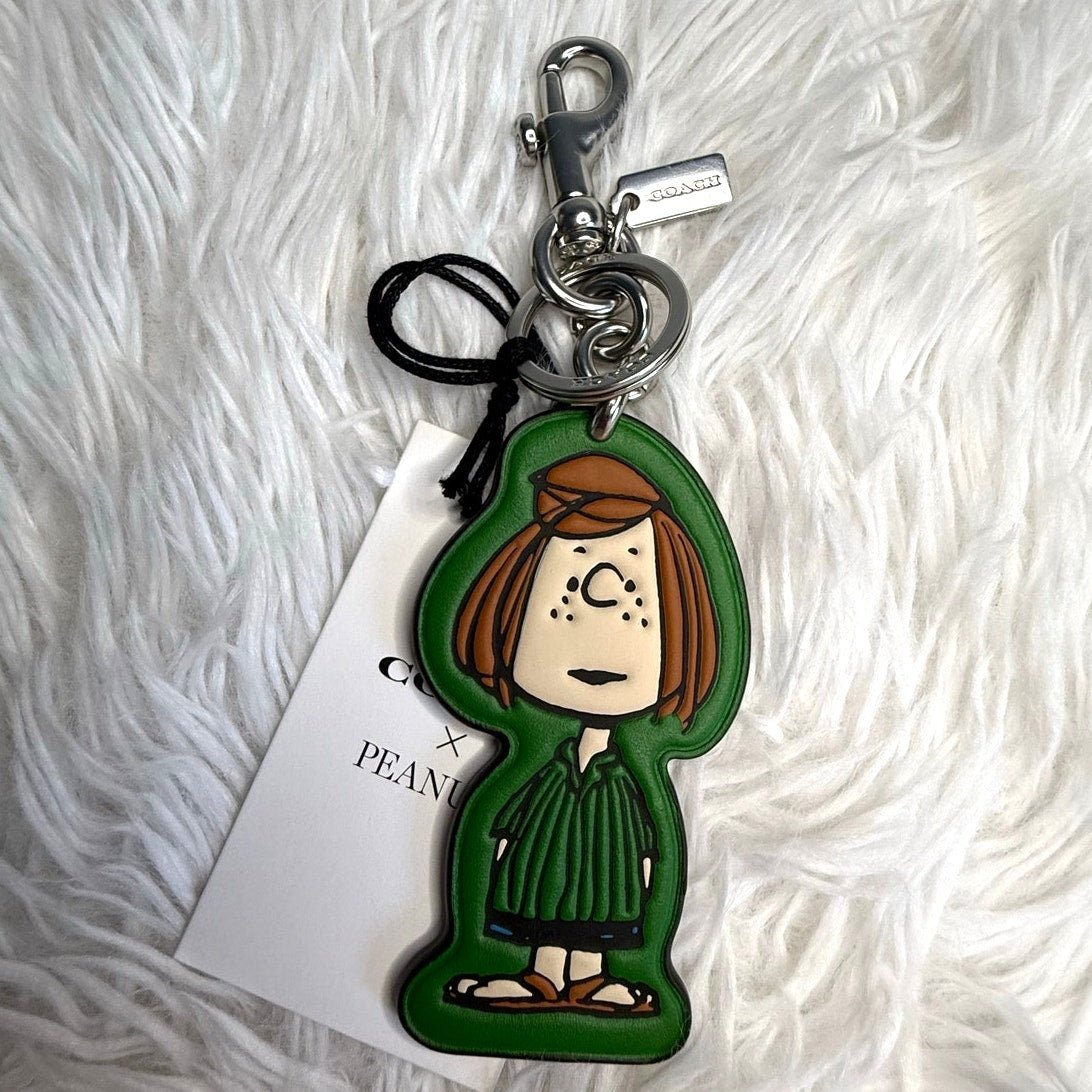 5de9da91-b994-4725-8927-7ddcb0a65087 NWT Coach X Peanuts Peppermint Patty Bag Charm - Image 1